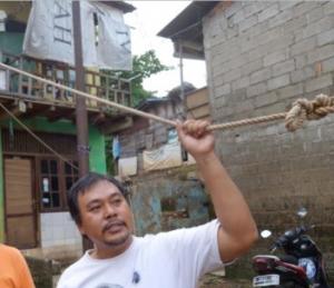 Ardy Ferdianto, a resident of Kampung Melayu in Jakarta, shows the dramatic effects of flooding.