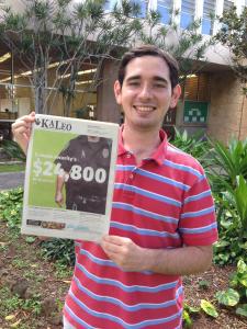 Ka Leo Editor Alex Bitter holds the issue that won Best of Show at a national convention.