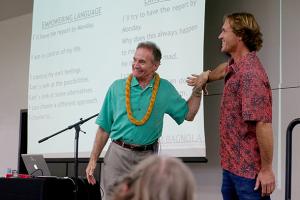 Jim Bagnola demonstrates on Ian Masterson how positive encouragement can affect human physiology.