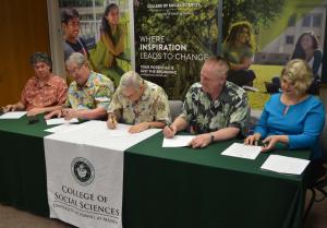 Representatives sign the memorandum of understanding.